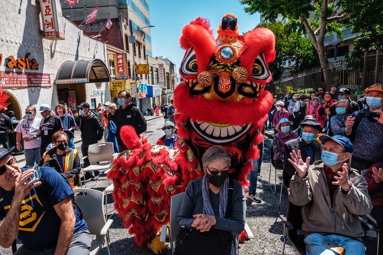 CYC Dancers perform a Lion Dance at a Summer block party at Ping Yuen public housing project in the heart of San Francisco&#39;s Chinatown on Saturday, July 17, 2021.