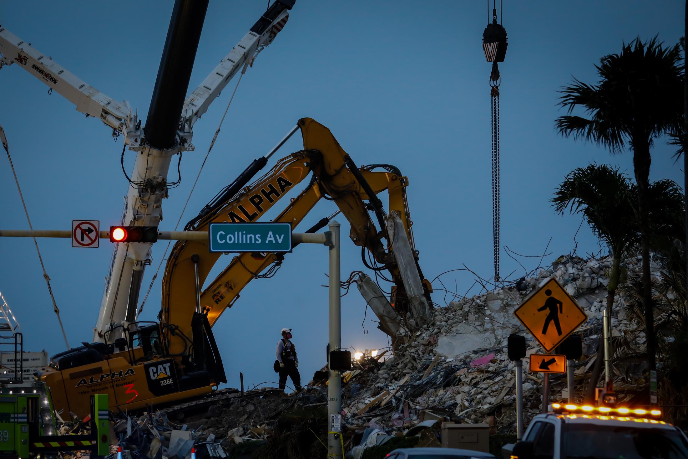 2021 - Surfside building collapsed - Search and rescue personnel continue to work on the...
