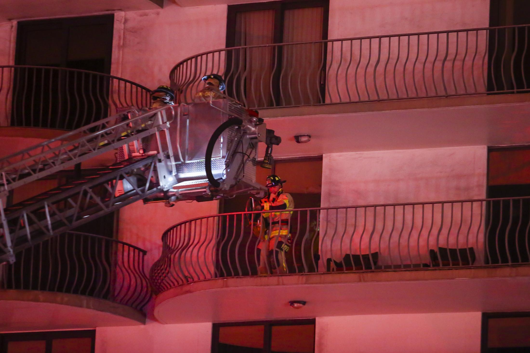 Surfside building collapsed - A rescue worker works on a balcony at a building...