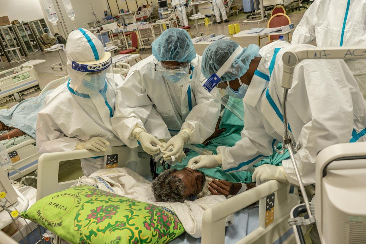  A patient infected with COVID-19 takes his last breaths while being treated by ICU medical staff at Millennium Hall, one of the biggest event venues in Addis Ababa on March 15, 2021. 