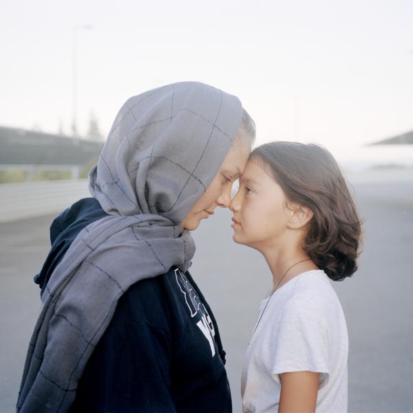 Image from In the Name of God -   Razieh, 29, and her daughter Yeganeh, 8, standing in...
