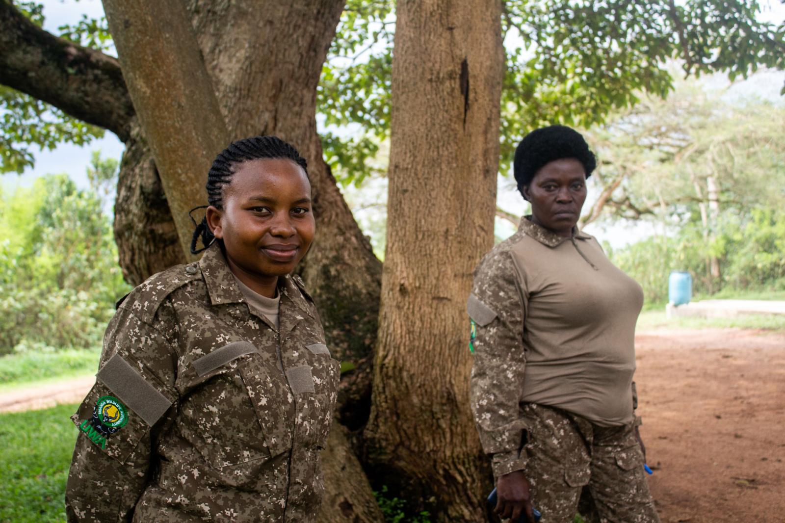 Annasezi, who has been a ranger for 15 years, stands alongside her colleague Loice, who joined the force three years ago.