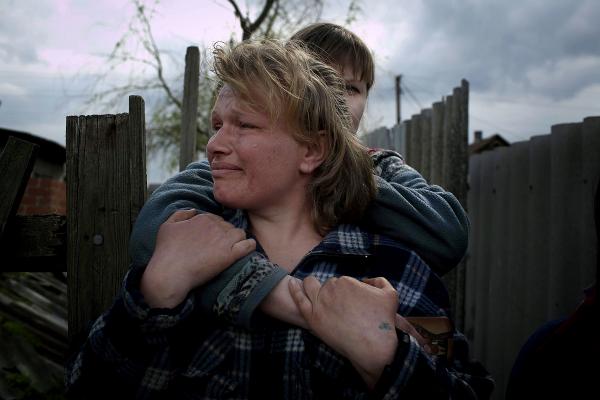 Ukraine Crisis-The East - Neighbors and friends of Pavel Pavelko, 42, one of three...
