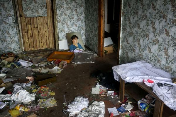 Ukraine Crisis-The East - A house partially destroyed by shelling, now used as a...