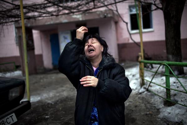 Image from Ukraine Crisis-The East - A Resident of Donetsk prays for shelling to stop in...