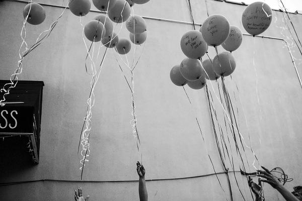 United We Thrive-Divided We Die - Balloons, flown into the air, by a group of mothers whose...