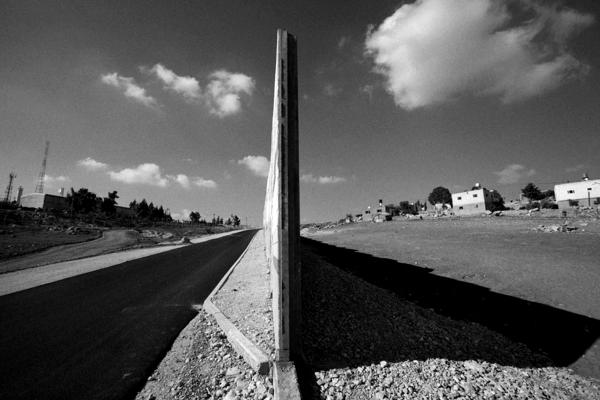 Image from The Land - The separation barrier which divides Eshkolot settlement...