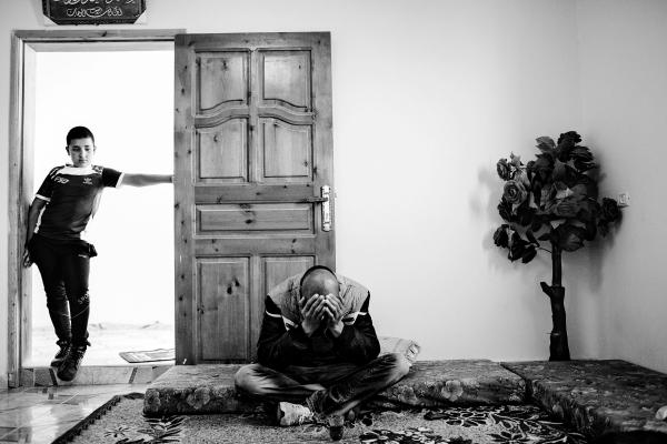 Image from The Land - Two brothers from Ar Ramadin tribe in their home. Their...