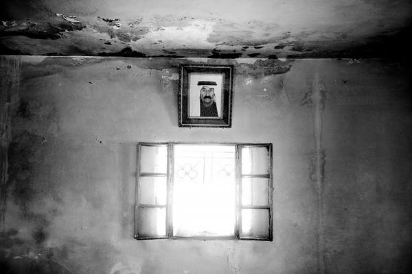 Image from The Land - An Ar Ramadin tribe elder picture hangs on the wall...