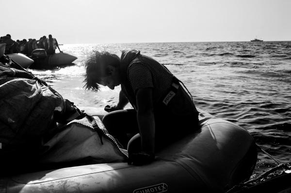 On Strange Waters - A member of Sea Watch crew, takes a very short break,...