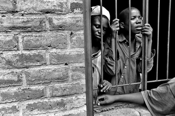 HIV/AIDS - East Africa - young boys looking through a barge window at namitete,...