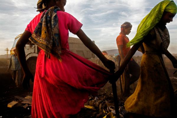 Villagers from Kalmi, gathering iron from the debris of a steel plant which was built in their village. Chhatisgrah.