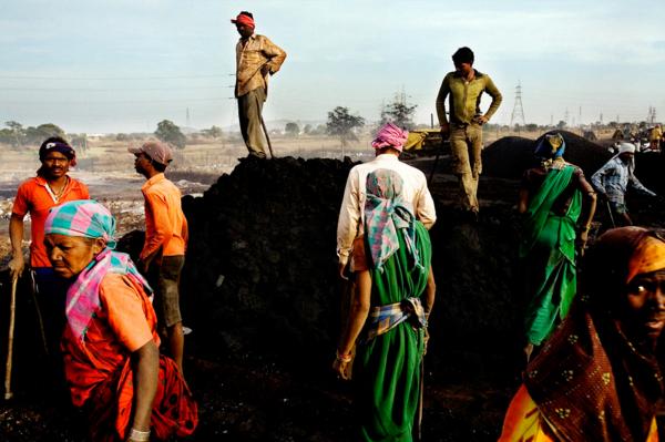 Villagers from Kalmi, gathering iron from the debris of a steel plant which inhabits their village. Chhatisgrah.