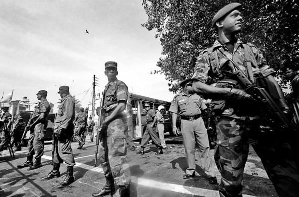 SLA (Sri Lanka army) soldiers guarding the site of a bus bombing, 4 people were killed and 20 injured, the attack, allegedly happened by the LTTE, in the capital Colombo.