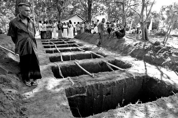 Graves ready for the burial of Sinhalese civilians , who were killed by a roadside claymore mine made allegedly by LTTE carders. &nbsp;26 people were killed and 63 injured in the attack. Buttala, South Sri Lanka.