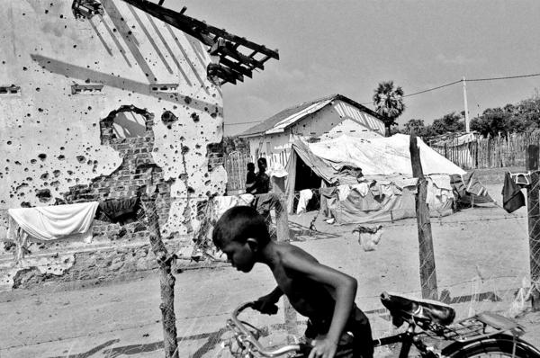 Sri Lanka Unrest - Tamil people at their destroyed home, which was taken by...