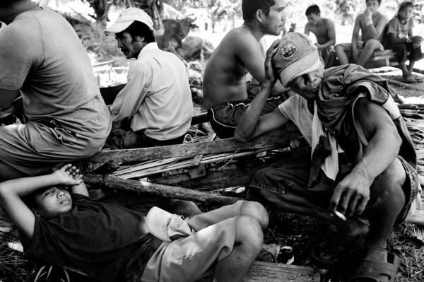 Taking a break during a long day of working in the fields, at the no mans land between christian and muslim communities.