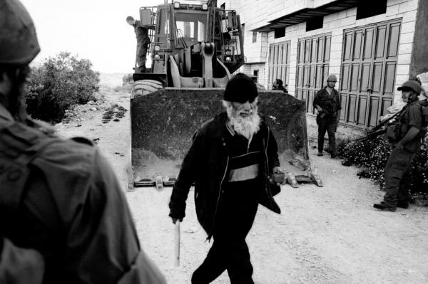 Reservists - Blocking a road at the entrance of a Palestinian village,...