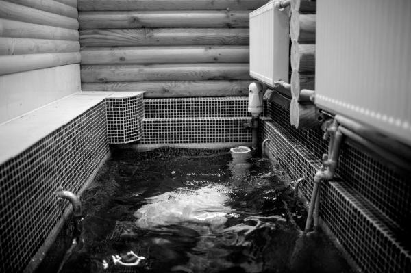 Shneor (31) who lives with his wife and two children in the village, washing himself in Anatevka synagogue Mikveh, before his morning pray. Mikveh is a bath used for the purpose of ritual immersion in Judaism to achieve ritual purity. Shneor came from Israel with his family in 2016 to live in Kiev, and in 2018 moved to be a teacher in Anatevka.