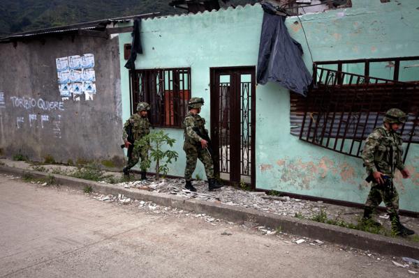Colombian army soldiers patrol the streets of Toribio, North Cauca.