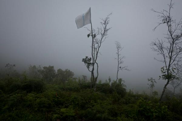 A white flag, marking the border between the area controlled by the Nasa and the Colombian army, on Mt Berlin, a disputed area. Toribio, North Caucain during July 2012 Indigenous activists stormed the hill top military base (on Mt Berlin) in protest over land rights.