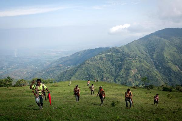 Members of the Nasa guard climbing Mt Dantas, in order to patrol disputed areas where the Colombian army is stationed in. Miranda, North Cauca.