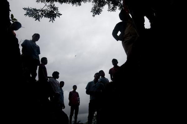Nasa people stand infant of an illegal mine , which the local leadership decided to shutdown, Canoas, North Cauca.
