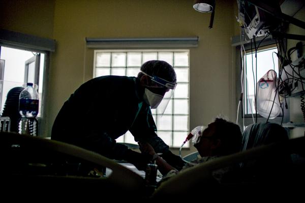 A doctor treats a Covid-19 patient in Ichilov hospital Covid emergency unit. Tel-Aviv.
