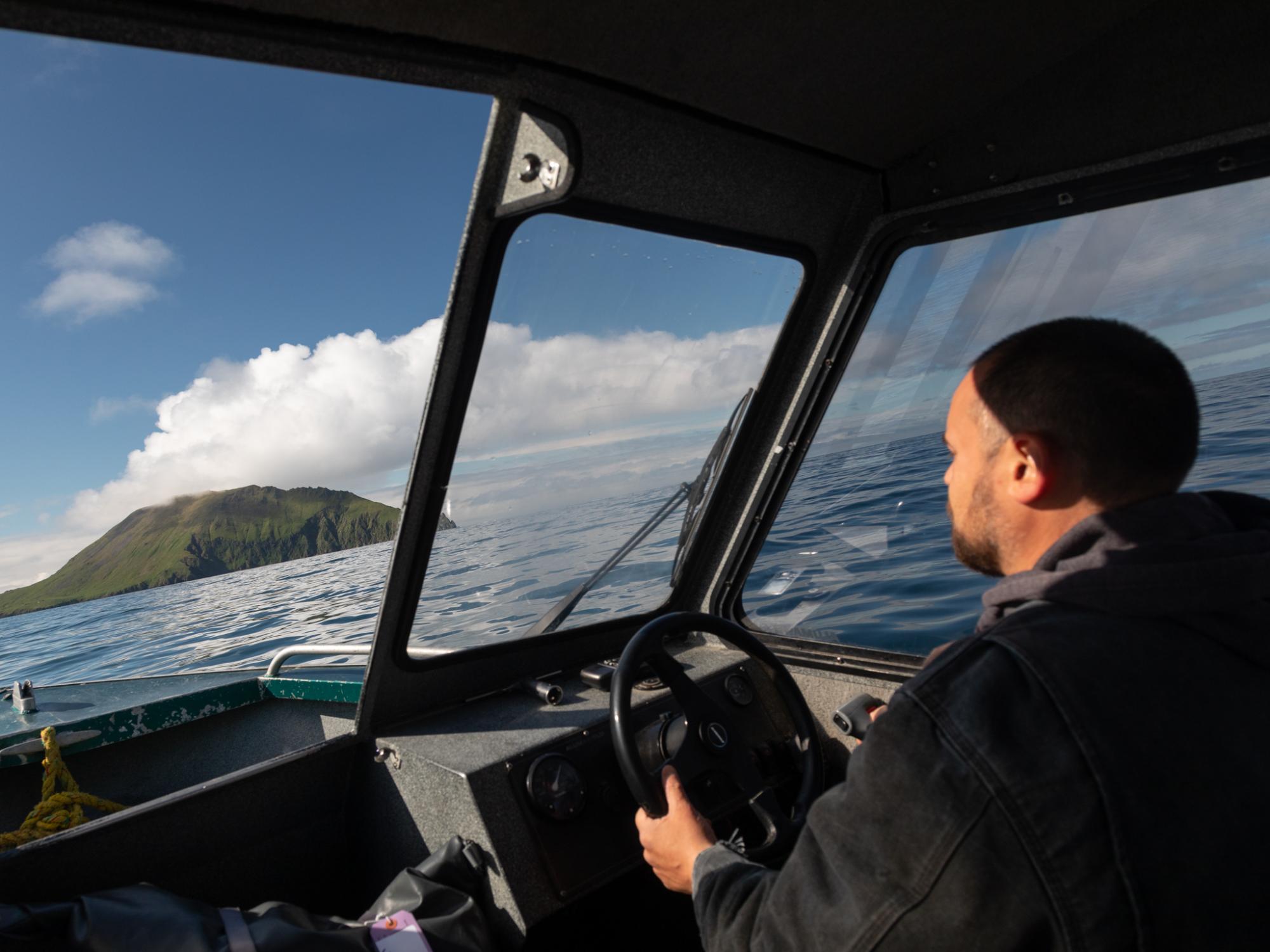 Boat operator Paul Markoff approaches Round Island, in the Walrus Islands State Game Sanctuary. The two-hour journey from Togiak on the Alaskan mainland requires calm seas and good visibility.