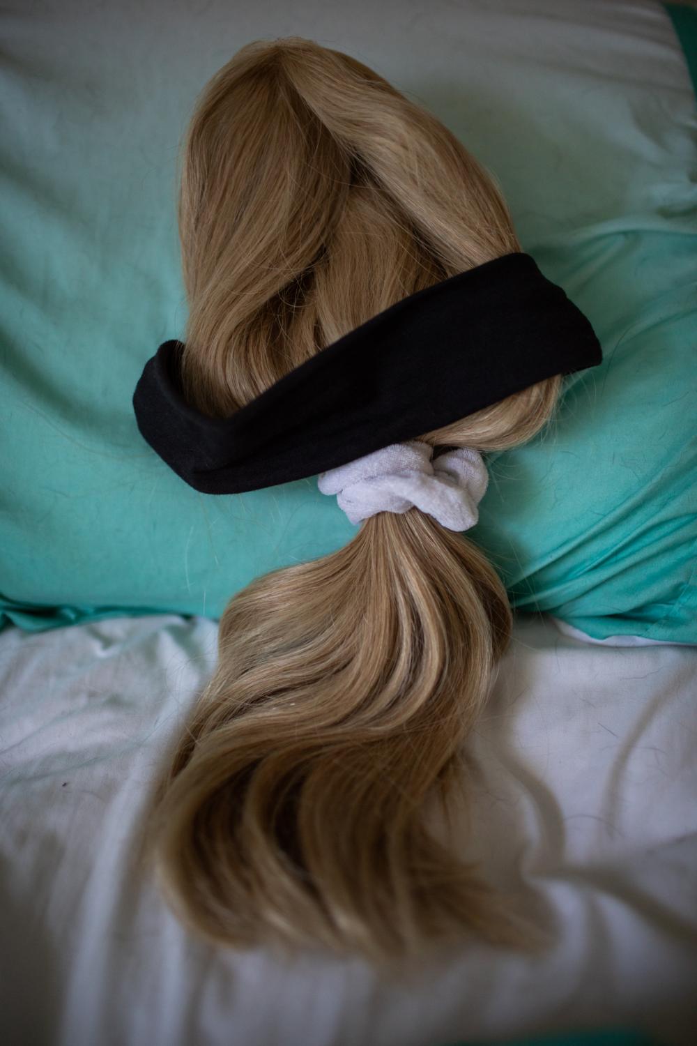 Jaylan wig lays on her bed, South Portland, Maine, September, 2021. Jaylan takes her wig at home...