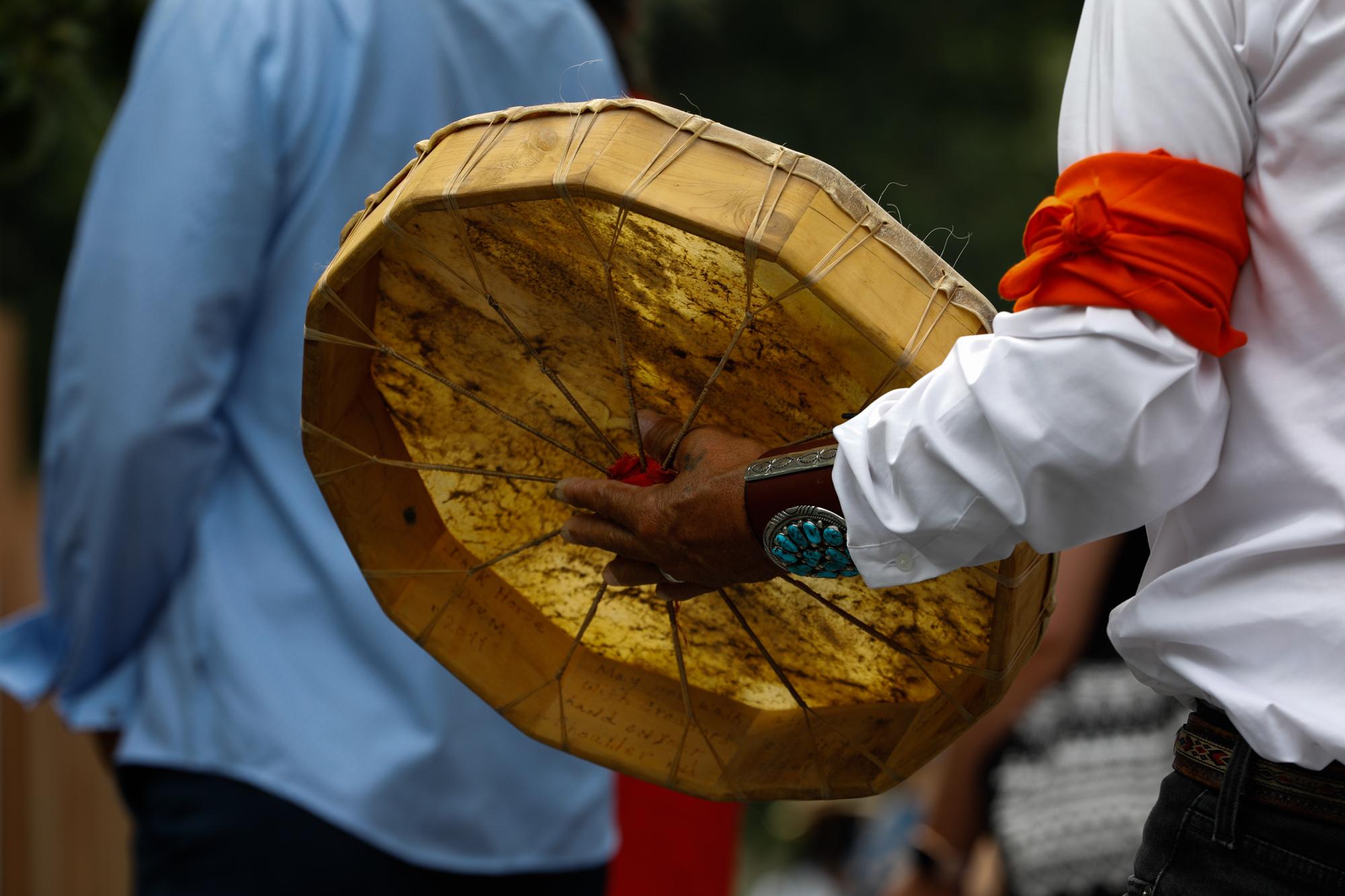 Red Road To Dc - Man plays hand drum in opening ceremony to welcome the...
