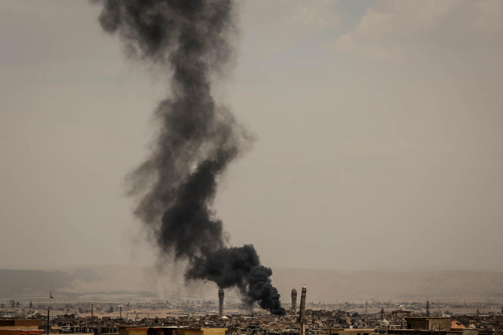 An airstrike hits near the Al N...aliphate in the summer of 2014.