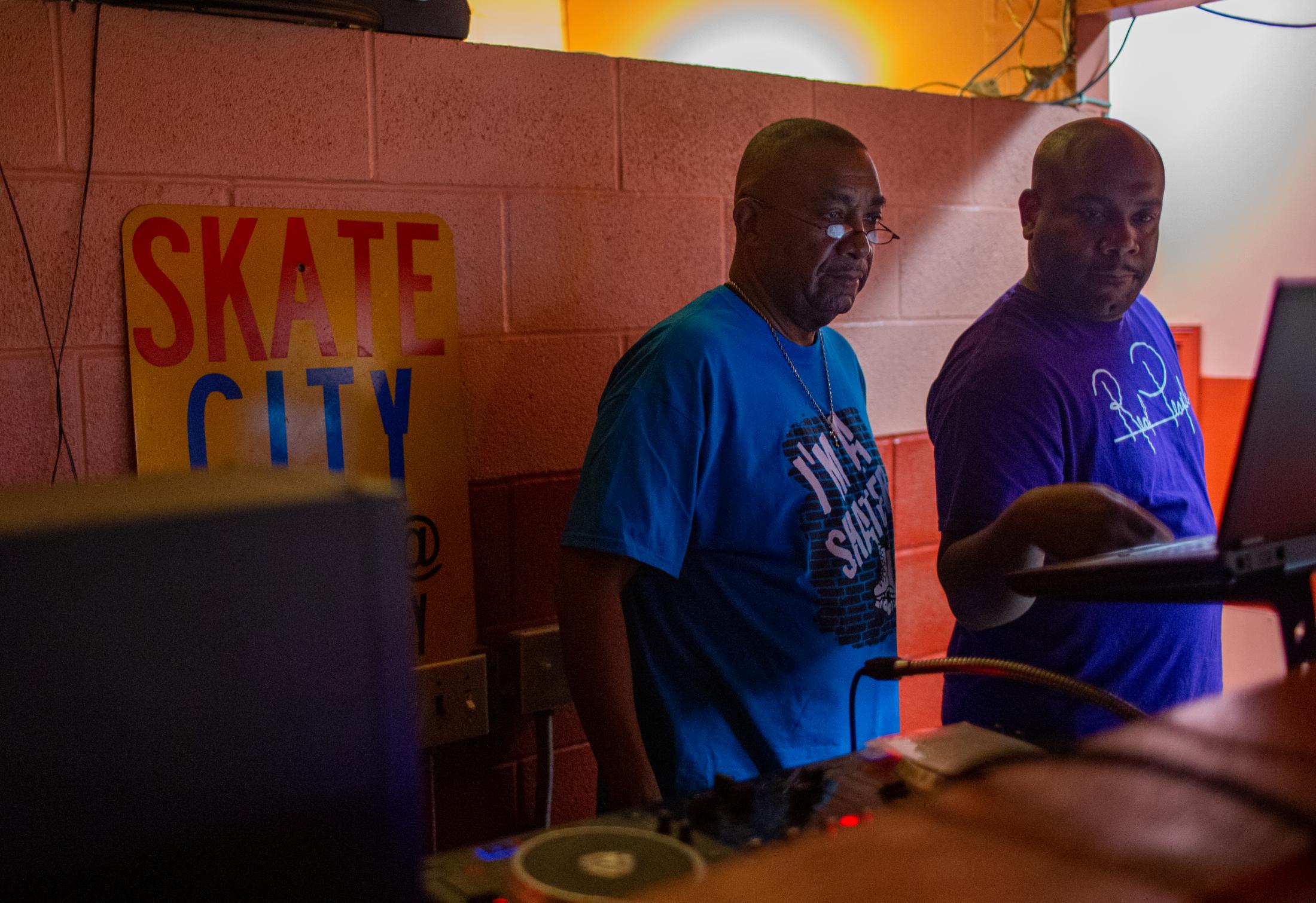 Skate City - Lawrence Wise, Sr., center, owner of Skate City, and his...