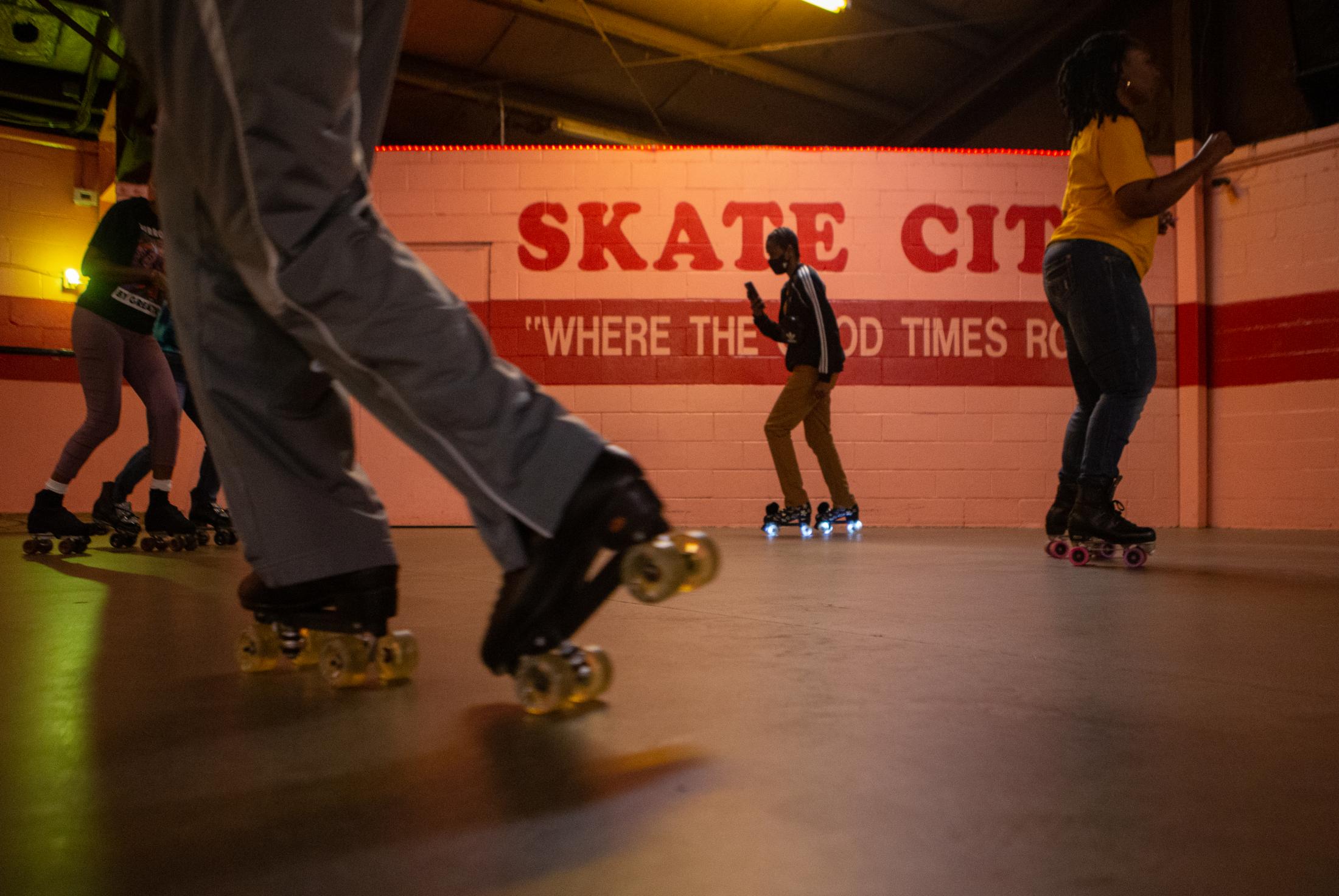 Skate City - Latish Scott from East St. Louis, center, checks her...