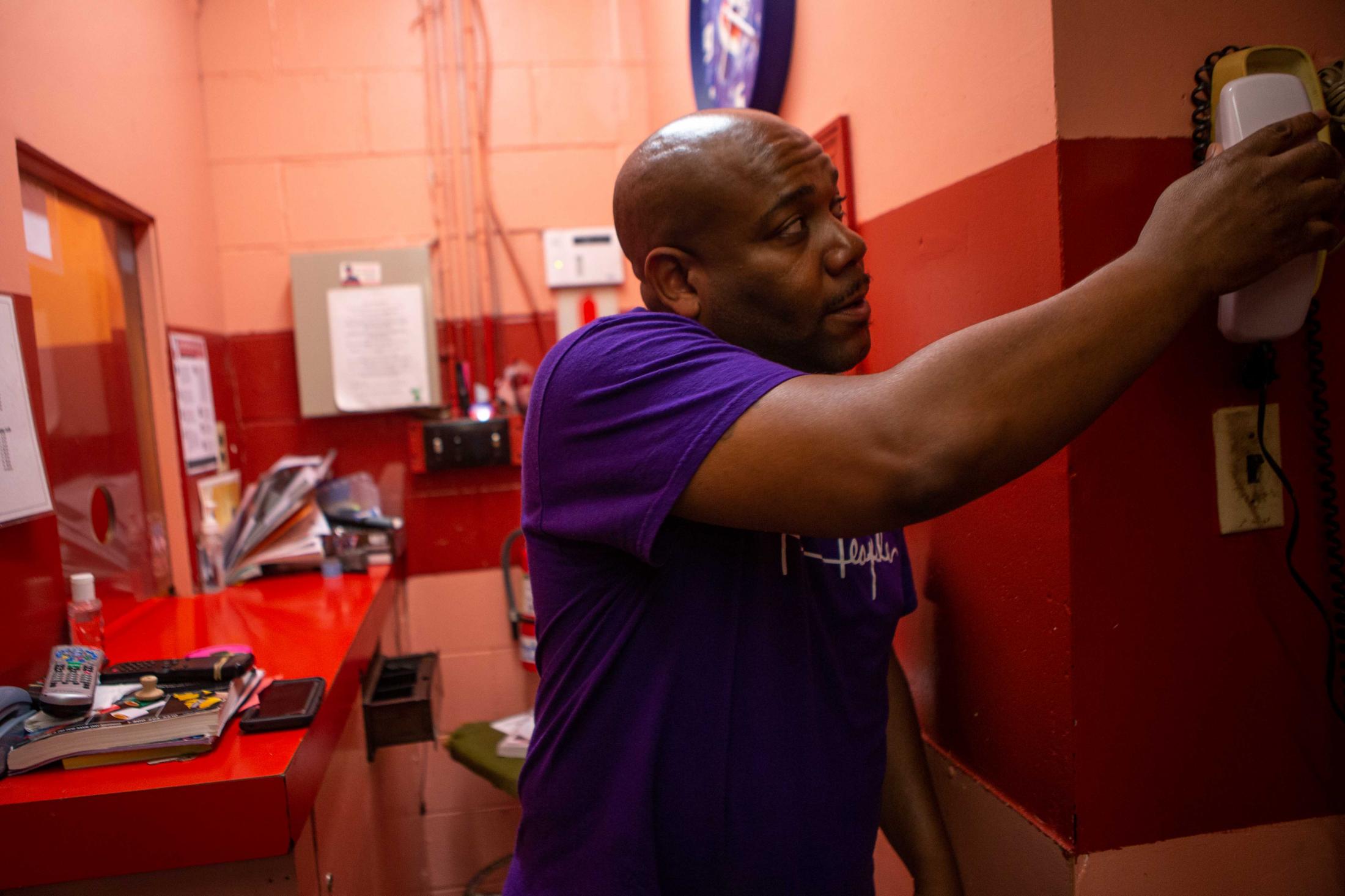 Larry Wise, son of Lawrence Wise, Sr., the owner of Skate City, answers a phone call in between checking in customers at Skate City on Monday, July 12, 2021, in East St. Louis. When not helping out at the skating rink, Larry is a police officer for the Shiloh Police Department in Shiloh, Illinois.