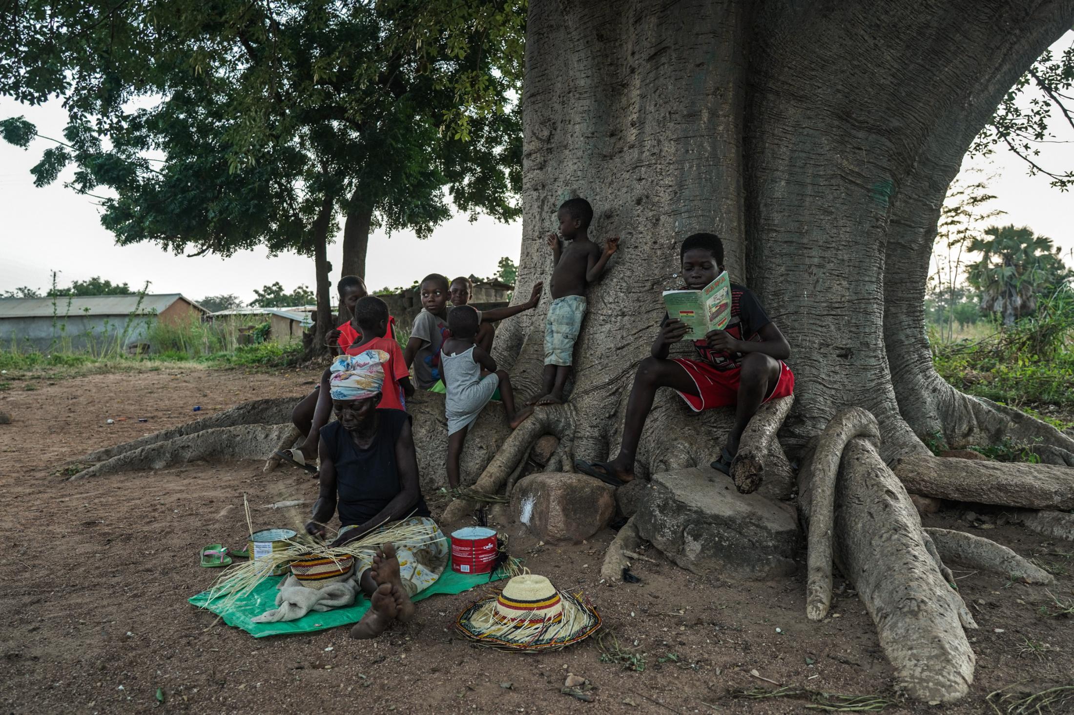 Tales Under the Baobab Tree - Gowrie Primary School student Bright Attiah (13) reads to...
