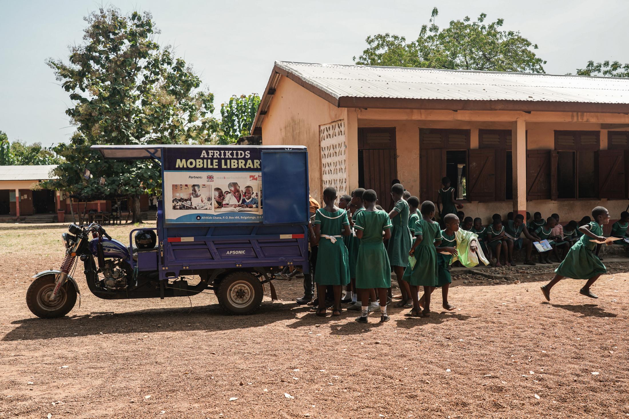 Tales Under the Baobab Tree - Students of Azenab Girls Primary School queue to get...