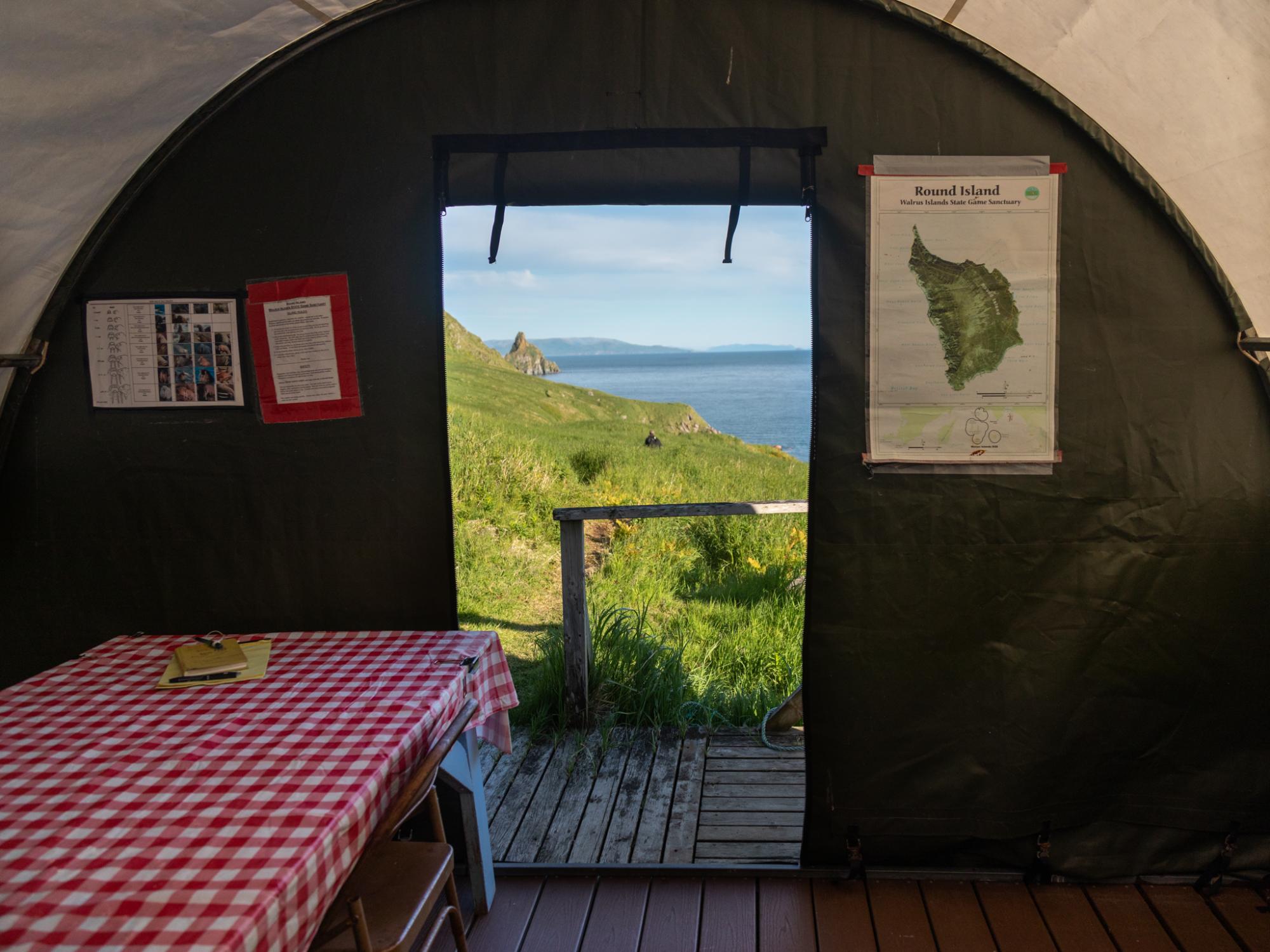 The cook tent in the visitor campground on Round Island. While campers are expected to be fully self-sufficient in most respects, this weatherproof tent provides a communal space in which to prep food, eat, and socialize.