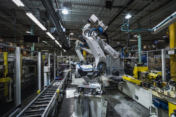 A robot makes the rear axle for the Chevrolet Cadillac and Camaro at the Linamar LPP Manufacturing Plant in Guelph Ontario on January 28, 2016. /Aaron Vincent Elkaim for the New York Times. 
