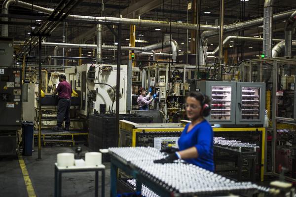 Image from Magna Factory - Workers manage the production of cam shafts at Linamar's...