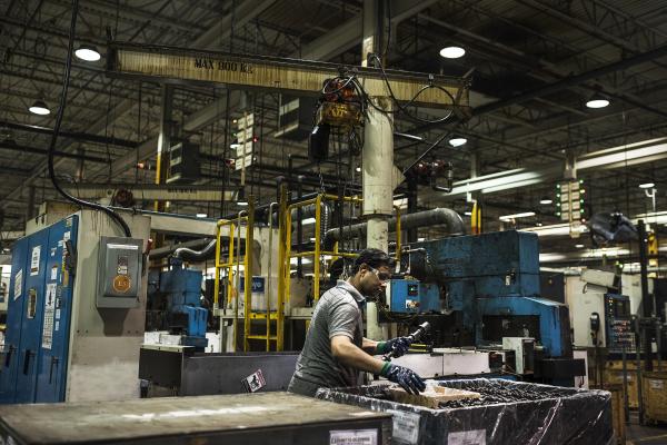 Image from Magna Factory - Workers manage the production of cam shafts at Linamar's...