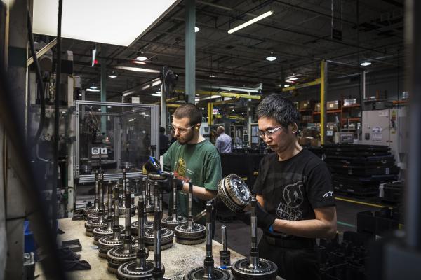 Image from Magna Factory - Linamar workers make a final inspection of automotive...