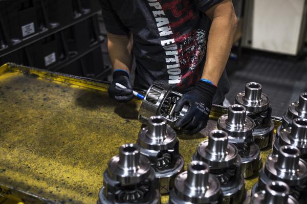 Image from Magna Factory - A Linamar worker assembles automotive parts at their LPP...