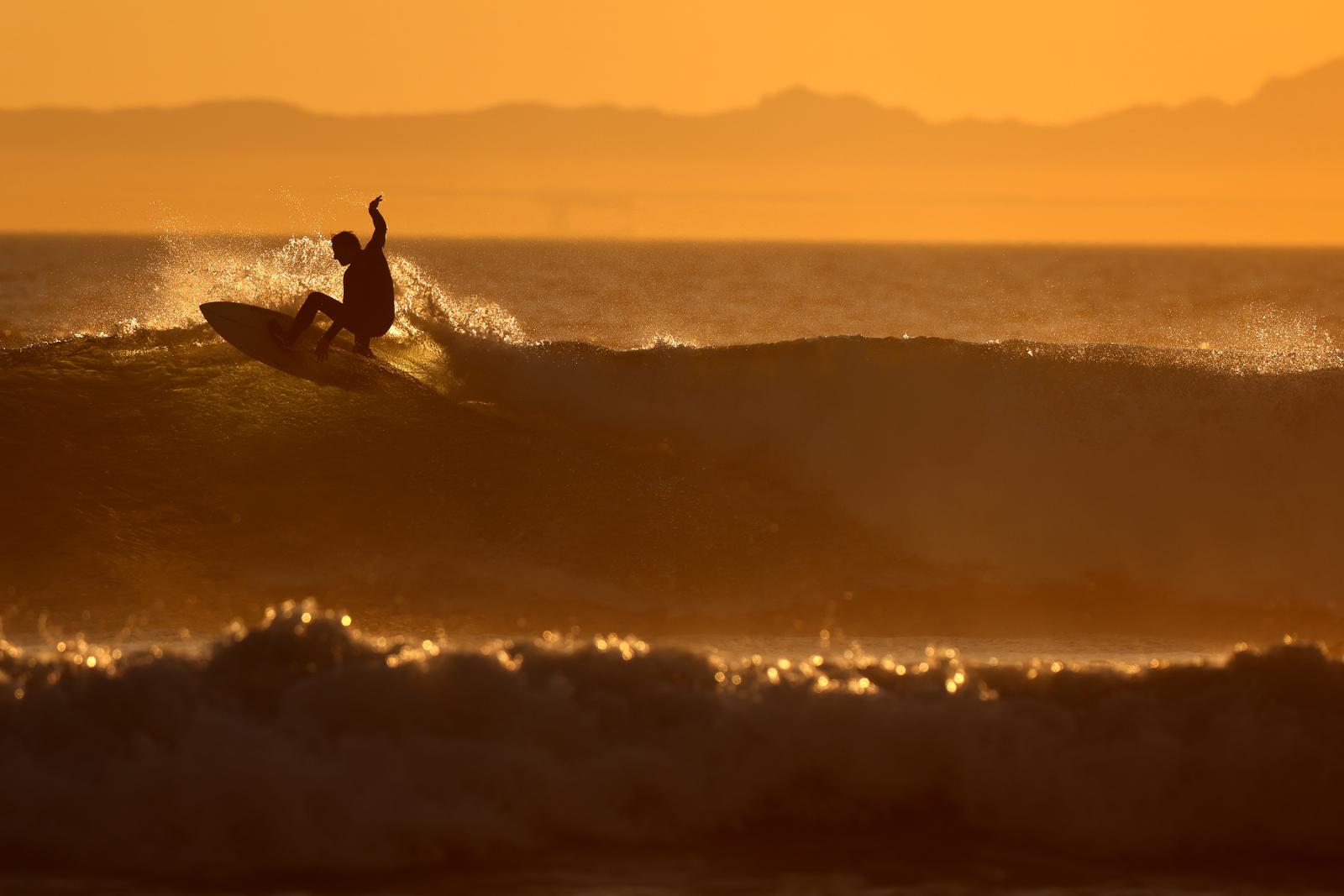 HUNTINGTON BEACH, CA - A surfer...n Huntington Beach, California.