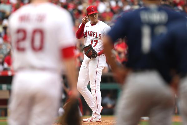 ANAHEIM, CALIFORNIA - SEPTEMBER 26: Shohei Ohtani #17 of the Los Angeles Angels signals from the mound to first baseman Jared Walsh #20 of the Los Angeles Angels during the fifth inning against the Seattle Mariners at Angel Stadium of Anaheim on September 26, 2021 in Anaheim, California. (Photo by Katharine Lotze/Getty Images)  
