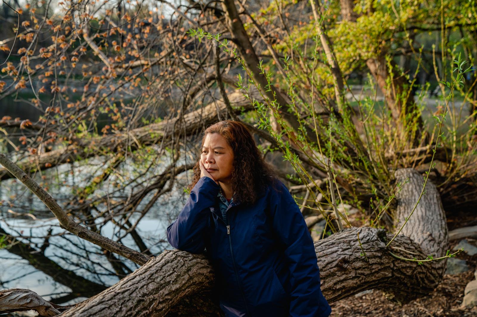 Image from NPR: Two Cantonese Women's Journey: A response to Atlanta Spa Shootings -  Liang Runling (梁润玲), 56, stands for a portrait at...
