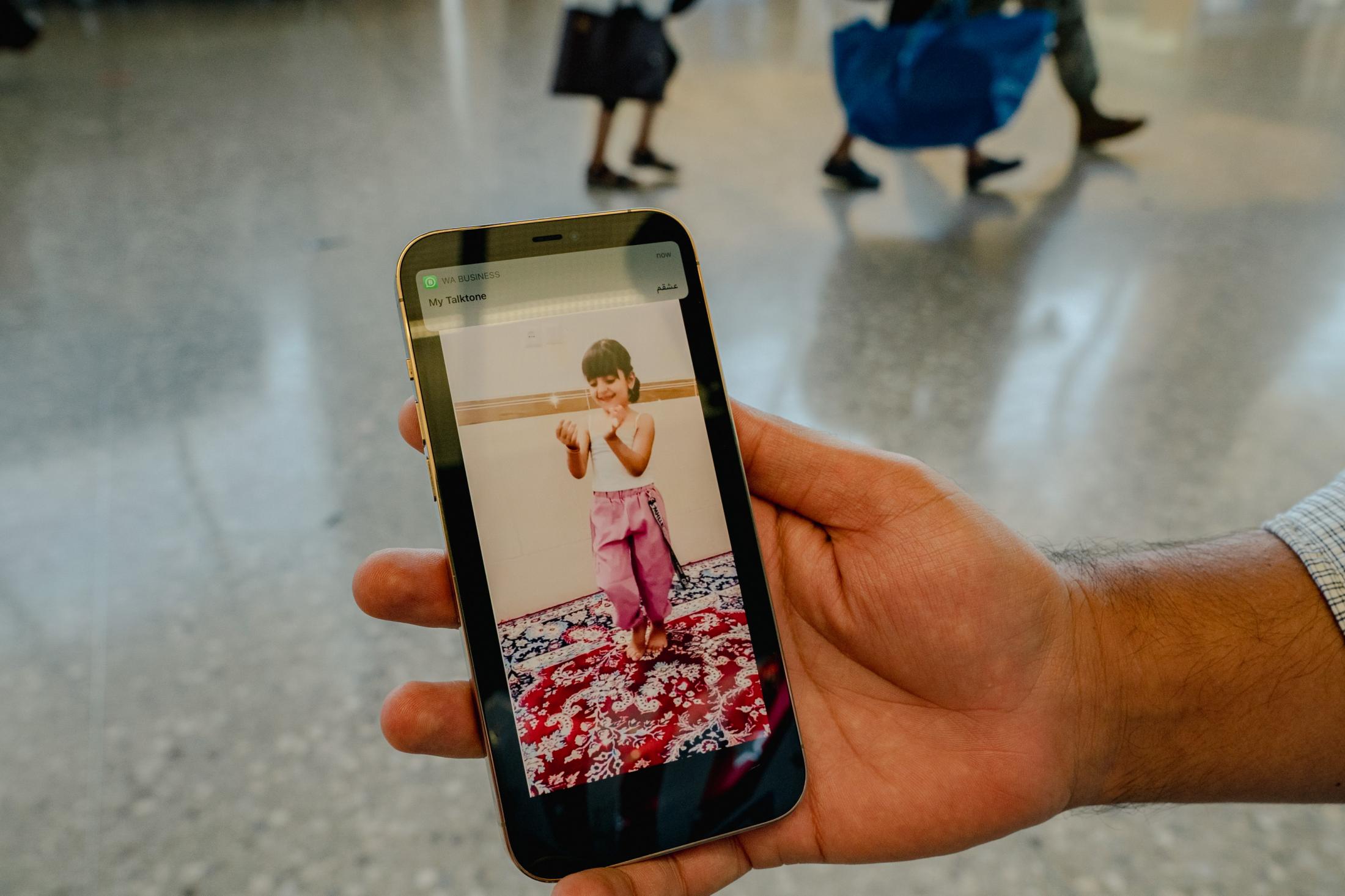 Ajmal shows an old video of his older daughter dancing at Dulles International Airport in Dulles, VA on Friday, Sept. 03, 2021.