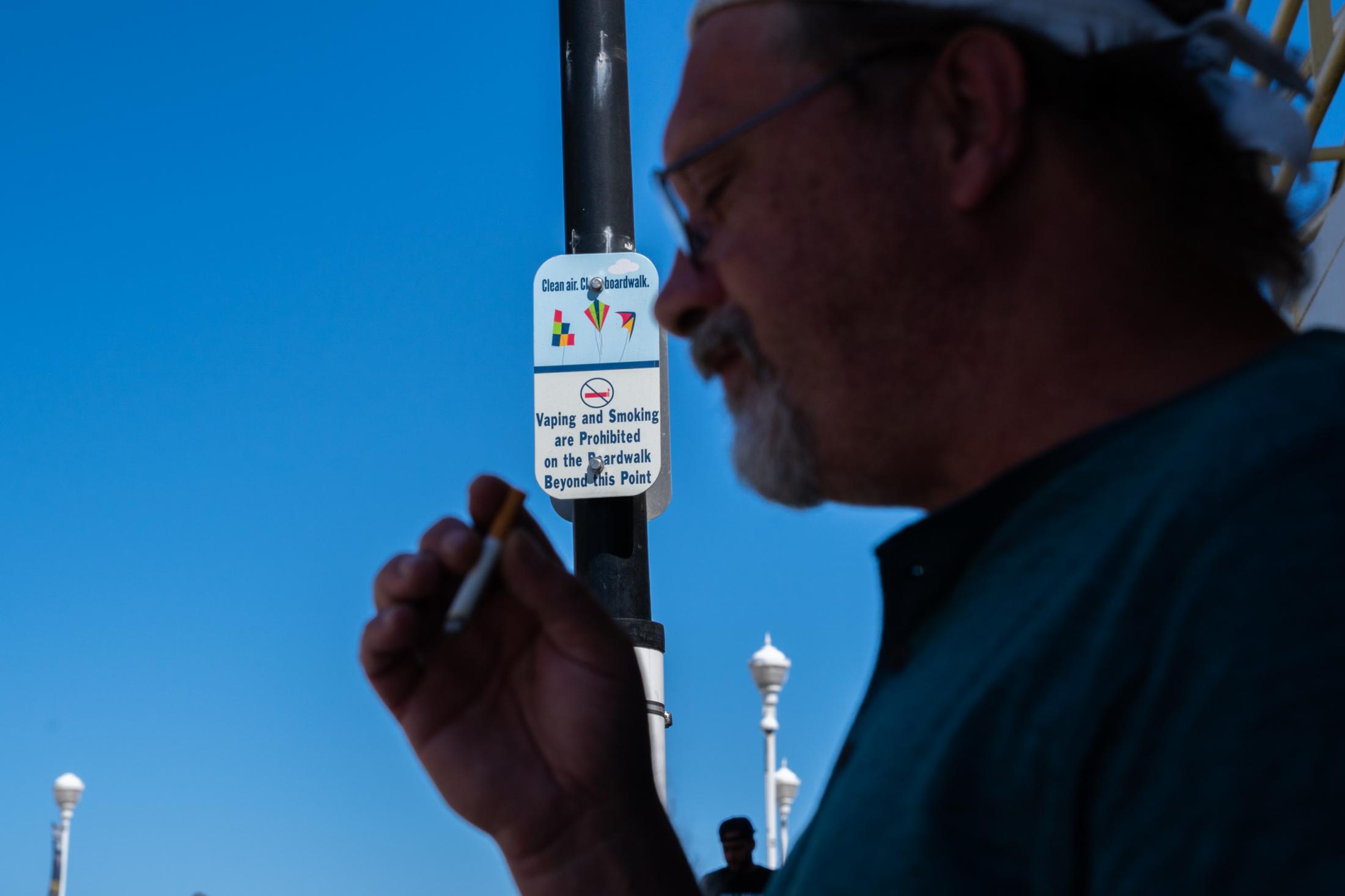 Questions about policing on Ocean City Boardwalk - Randy Testerman smokes beyond the restriction area near...