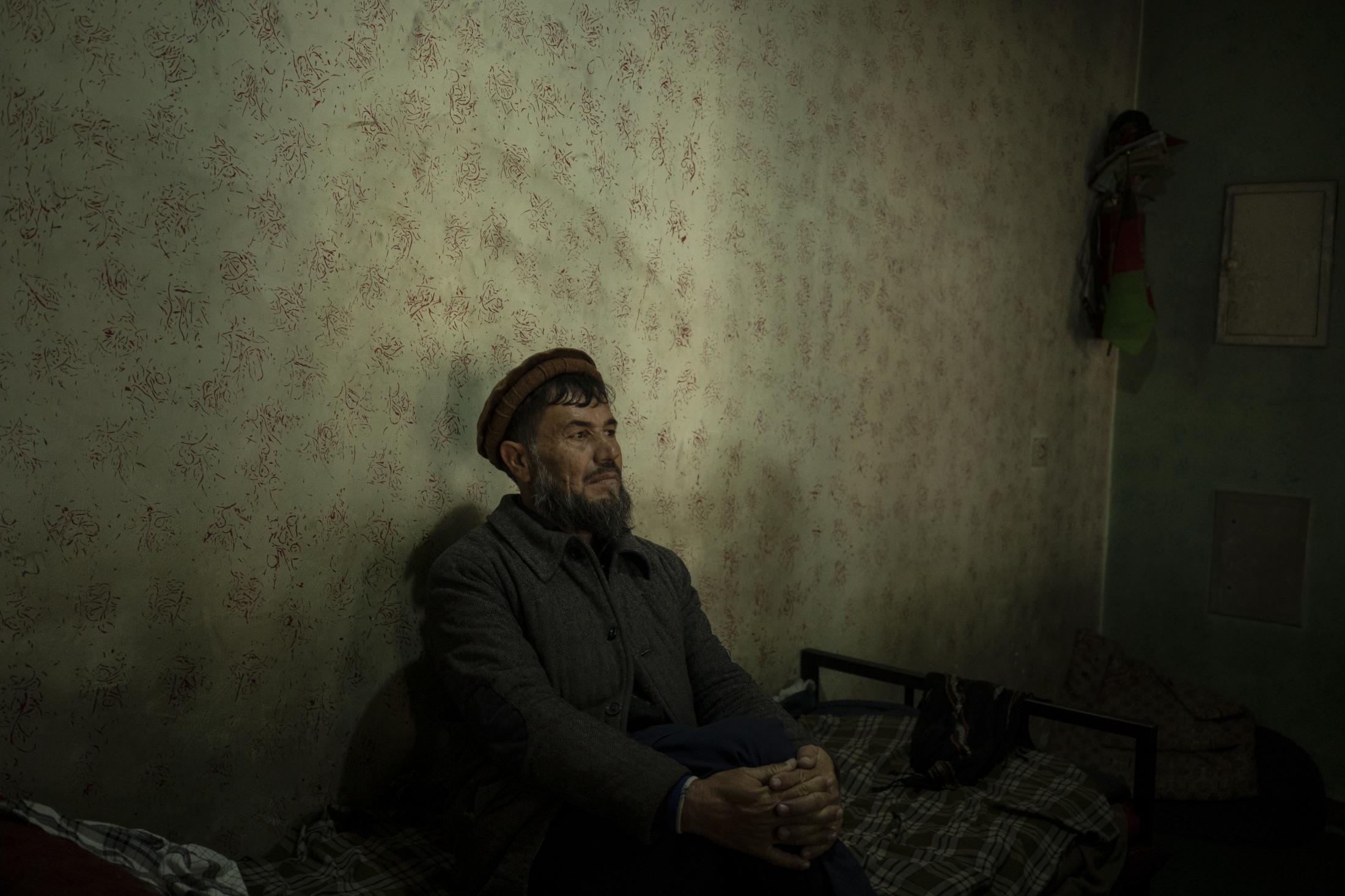 The Cinema of Kabul - Abdul Fatah sits on his bed inside the Ariana Cinema in...