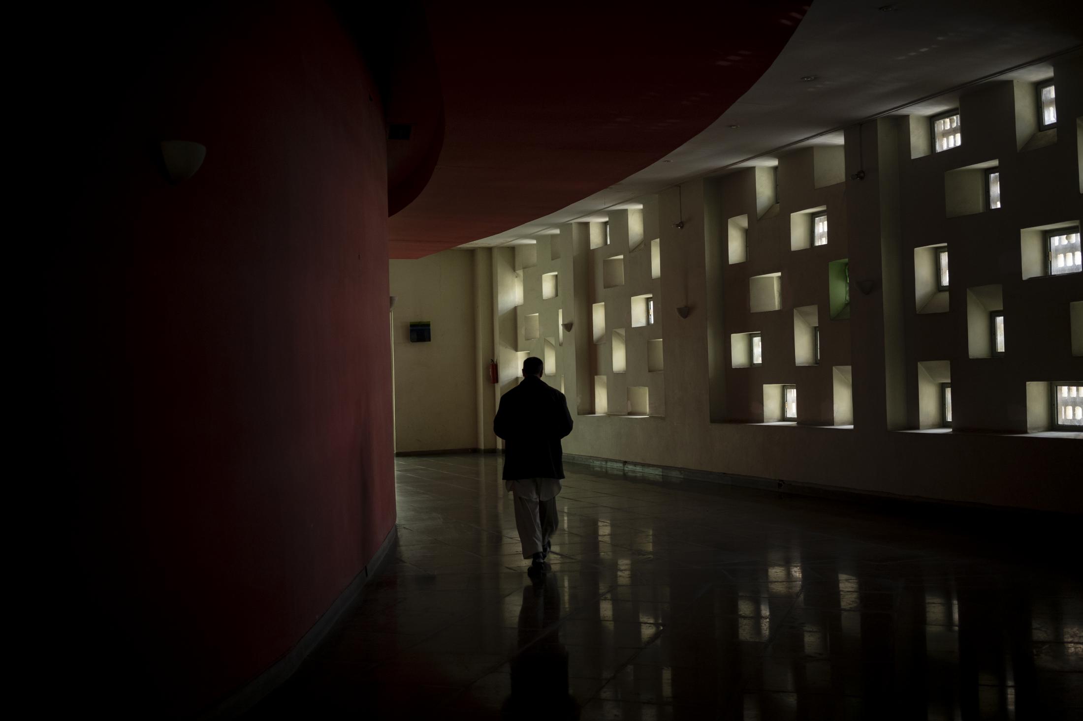 The Cinema of Kabul - A staff member walks in the hallways of the Ariana Cinema...